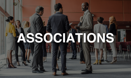 Corporate professionals mingling at a professional event